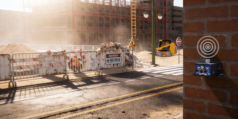 Satevis wireless inclinometer mounted on a brick wall monitoring a construction site, illustrating structural health monitoring installation and automatic zeroing calibration.